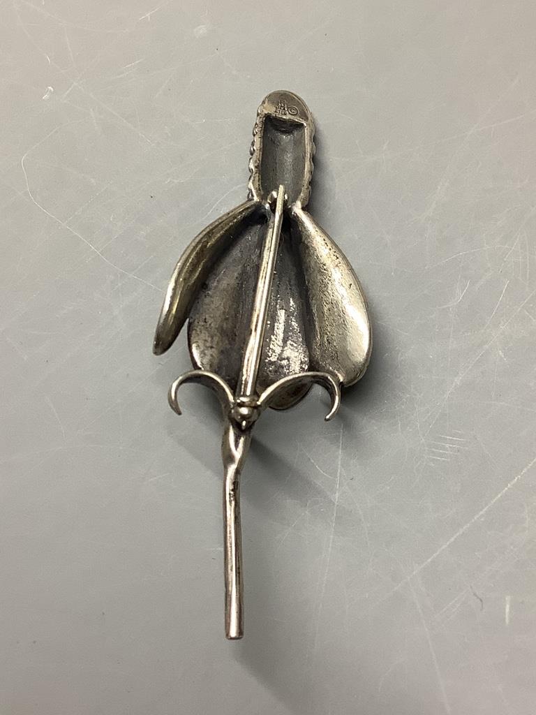 A white metal (stamped 'Ster') flower head brooch, signed JA, 71mm, 14.6 grams.